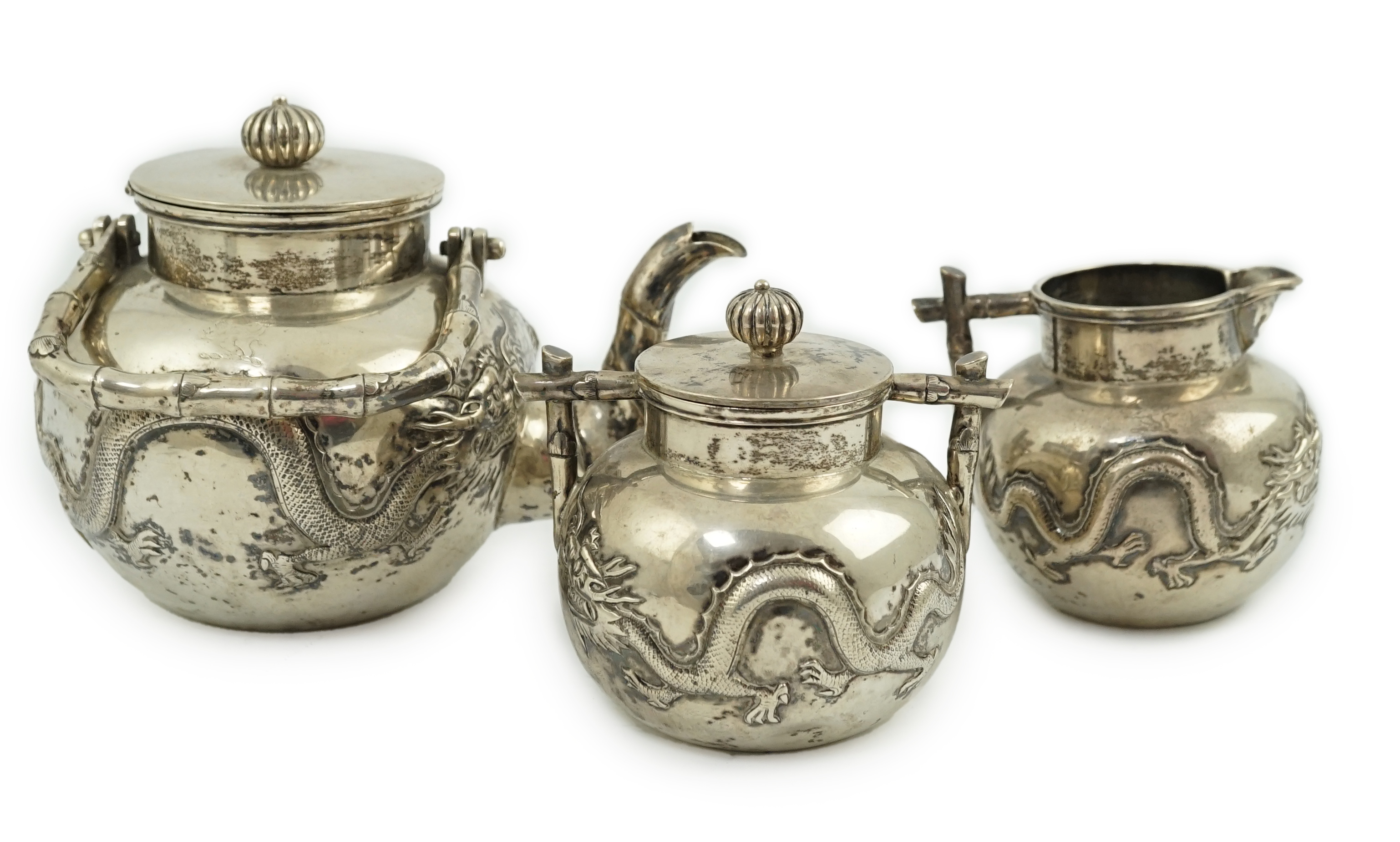 A late 19th/early 20th century Chinese Export silver three piece tea set, by Luen Wo, Shanghai